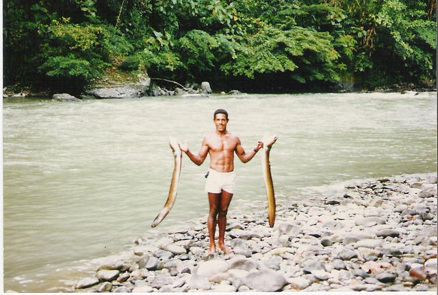 Bonnie with a couple of catfish. Anga Banga river PNG 1986